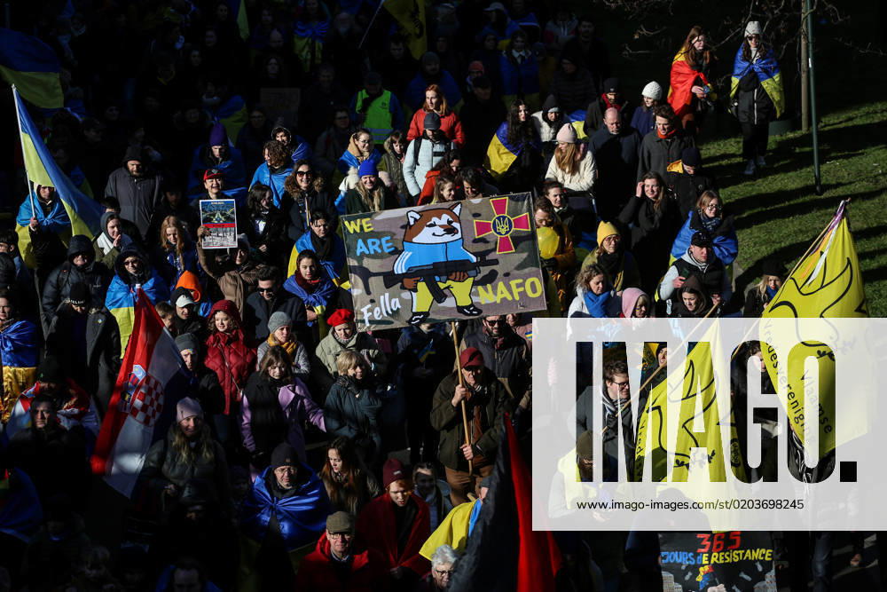 Demonstrators hold signs and Ukrainian flags during a demonstration in occasion of the one-year anniversary of Russia s invasion of Ukraine in Brussels, Belgium, February 25, 2023. Brussels Belgium - ZUMAm177 20230225_zip_m177_013