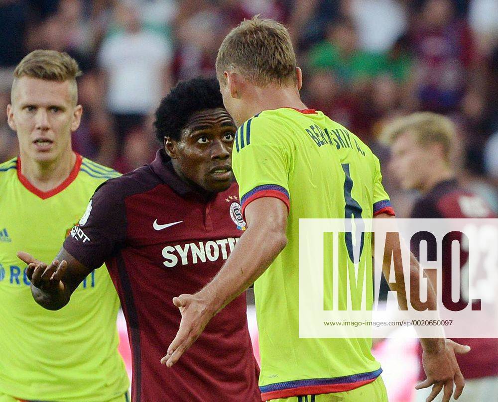 Tiemoko Konate, of Sparta, left to right, and Aleksei Berezutski of CSKA Moscow discuss during the third qualifying round of the Champions League return match between AC Sparta Prague and CSKA Moscow in Prague, Czech Republic, on Wednesday, August 5, 2015. (CTKxPhoto MichalxDolezal) CTKPhotoP201508050851901 dol 013