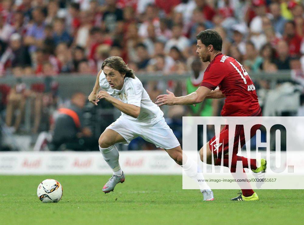 Bayern Munich s Xabi Alonso tussles with Real Madrid s Luka Modric Audi Cup 2015 - Bayern Munich vs Real Madrid - Allianz Arena- Munich -Germany - 5th August 2015 - Picture David Klein Sportimage .