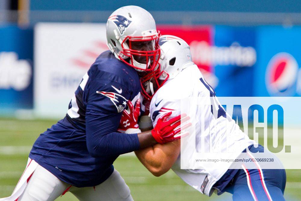 New England Patriots defensive end Chandler Jones (95) and New England Patriots fullback James Develin (46)participate in drills during NFL American Football Herren USA training camp at Gillette Stadium. NFL 2015: Patriots Training Camp AUG 07 - ZUMAc04_