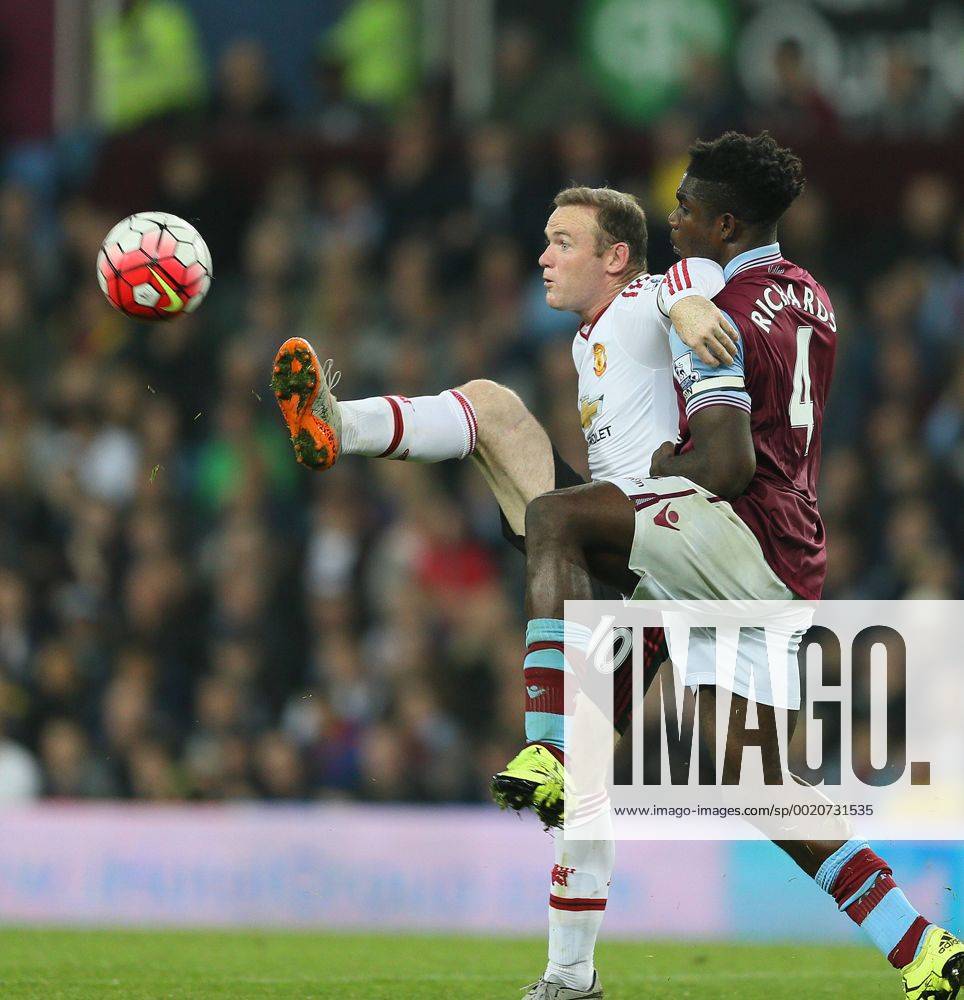 Wayne Rooney of Manchester United ManU tussles with Micah Richards of Aston Villa - English Premier League - Aston Villa v Manchester Utd - Villa Park Stadium - Birmingham - England - 14th August 2015 - Picture Simon Bellis Sportimage .