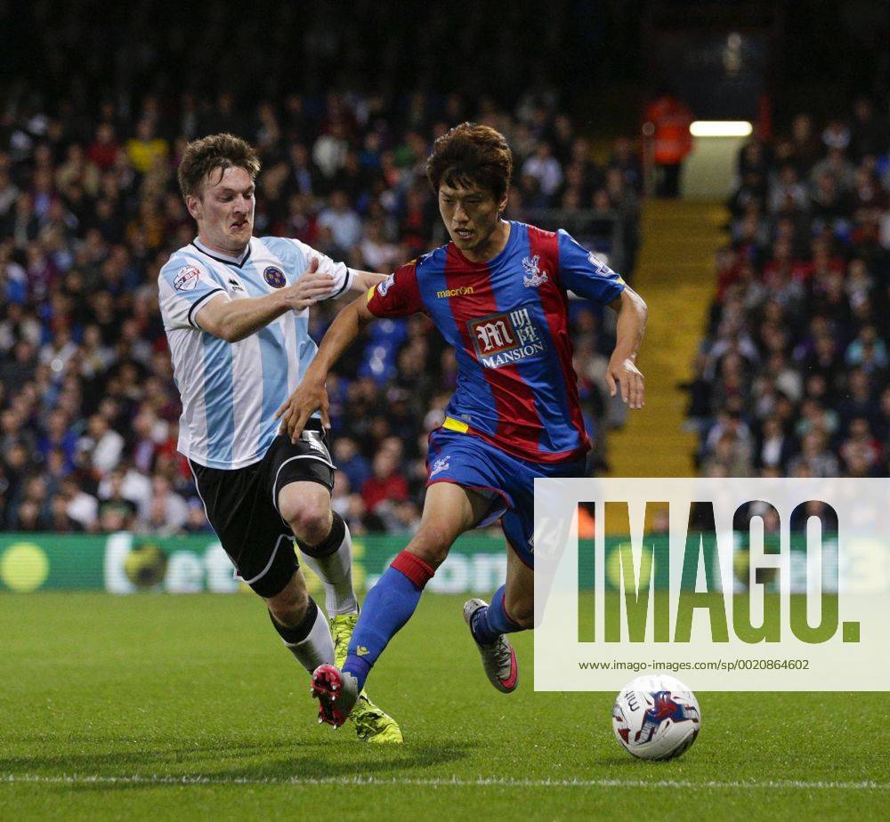 London, England. Capital One Cup 2nd Round. Crystal Palace versus Shrewsbury. Shrewsbury Town s opening goalscorer Matt Tootle with a challenge on Crystal Palace& x2019;s Chung-yong Lee Mercerx ActionPlus11653609