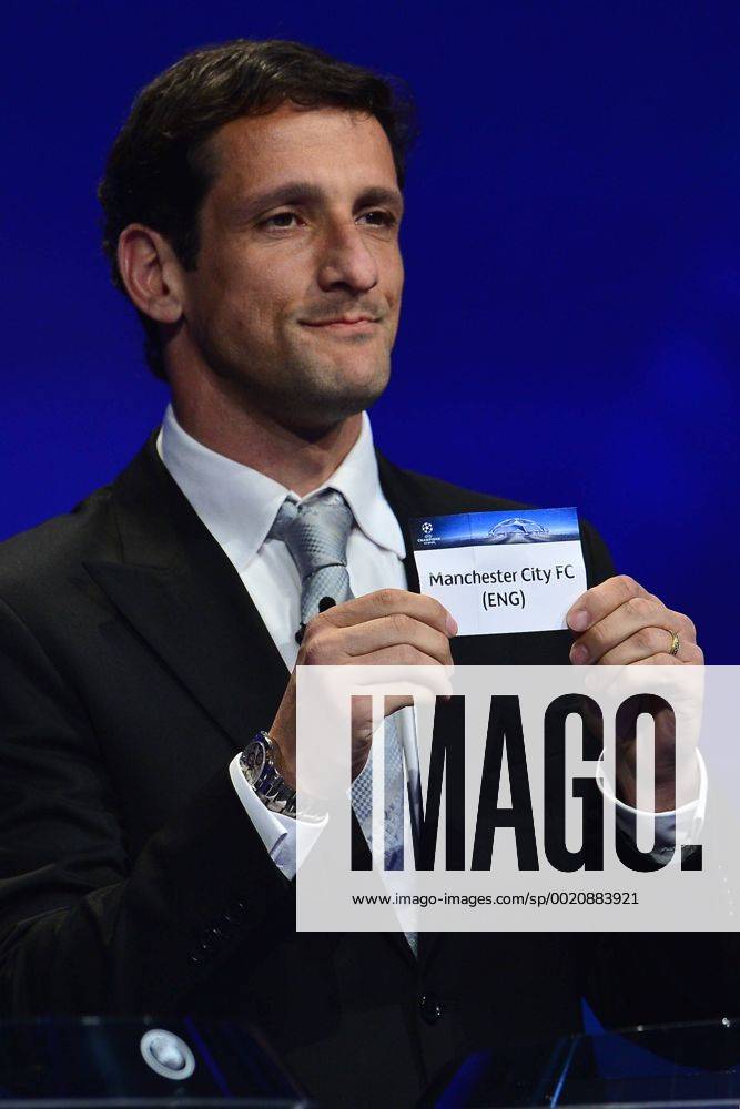 Aug. 27, 2015 - Monaco, Monaco - JULIANO BELLETTI ex Barcelona soccer player shows the draw result of Manchester City FC during the UEFA Champions League Draws 2015 - 16 at Grimaldi Forum. Soccer 2015 - UEFA Champions League 2015 - 16 Draw - ZUMAm119