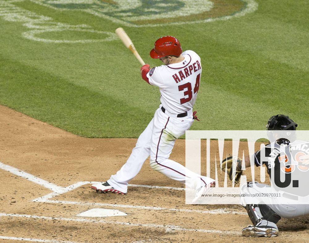 Washington, District Of Columbia, U.S - Washington Nationals left fielder Bryce Harper (34) connects for a three run home run making the score 5 - 3 in the fourth inning against the Florida Marlins at Nationals Park in Washington, D.C. on Wednesday, April 9, 2014. MLB Baseball Herren USA 2014 - Marlins Beat Nationals 7-1 - ZUMAp124