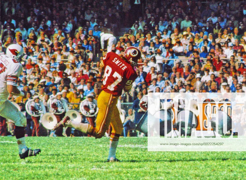 Washington, District of Columbia, United States of America - Washington Redskins tight end Jerry Smith (87) carries the ball after making a catch during the game against the St. Louis Cardinals at RFK Stadium in Washington, DC on October 21, 1973. The Redskins won the game 31-13..Credit: Jerry Smith - ZUMAs152