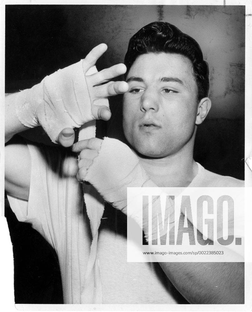 MAR 21, 1961 -- George Chuvalo tapes his hand before a workout - ZUMAt14_
