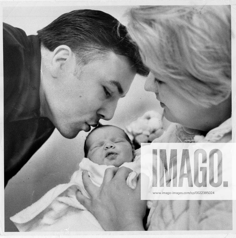 Canadian boxing champ George Chuvalo views his new daughter, Vanessa, being held by his wife Lynne - ZUMAt14_