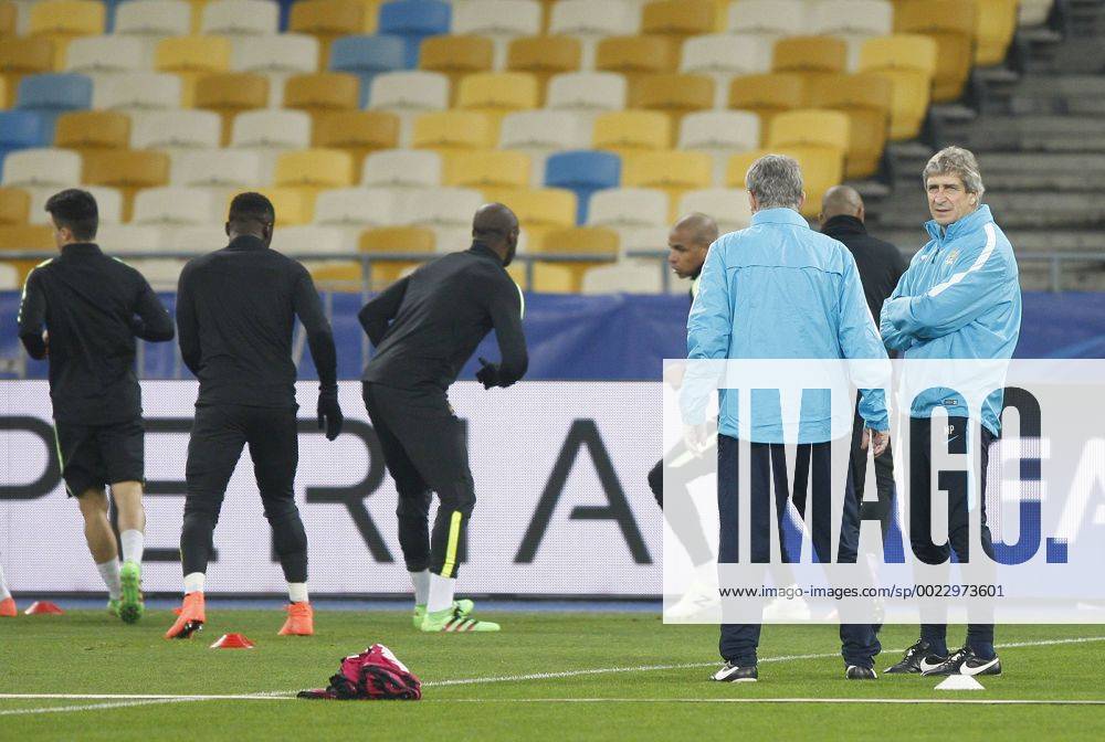 Feb. 23, 2016 - Kiev, Ukraine - Manchester City s manager Manuel Pellegrini (R) looks at training session of the players,at Olimpiyskiy stadium,in Kiev,Ukraine,23 February,2016. Manchester City will face Dynamo Kyiv in the UEFA Champions League round of 16 football match,on 24 February,2016. FC Manchester City press conference PK Pressekonferenz and Training Session - ZUMAn230