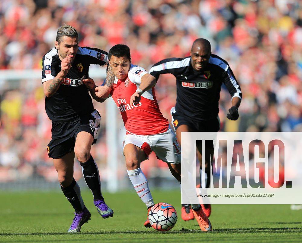 Arsenal s Alexis Sanchez tussles with Watford s Valon Behrami during the Emirates FA Cup match at The Emirates Stadium. Photo credit should read: David Klein Sportimage .