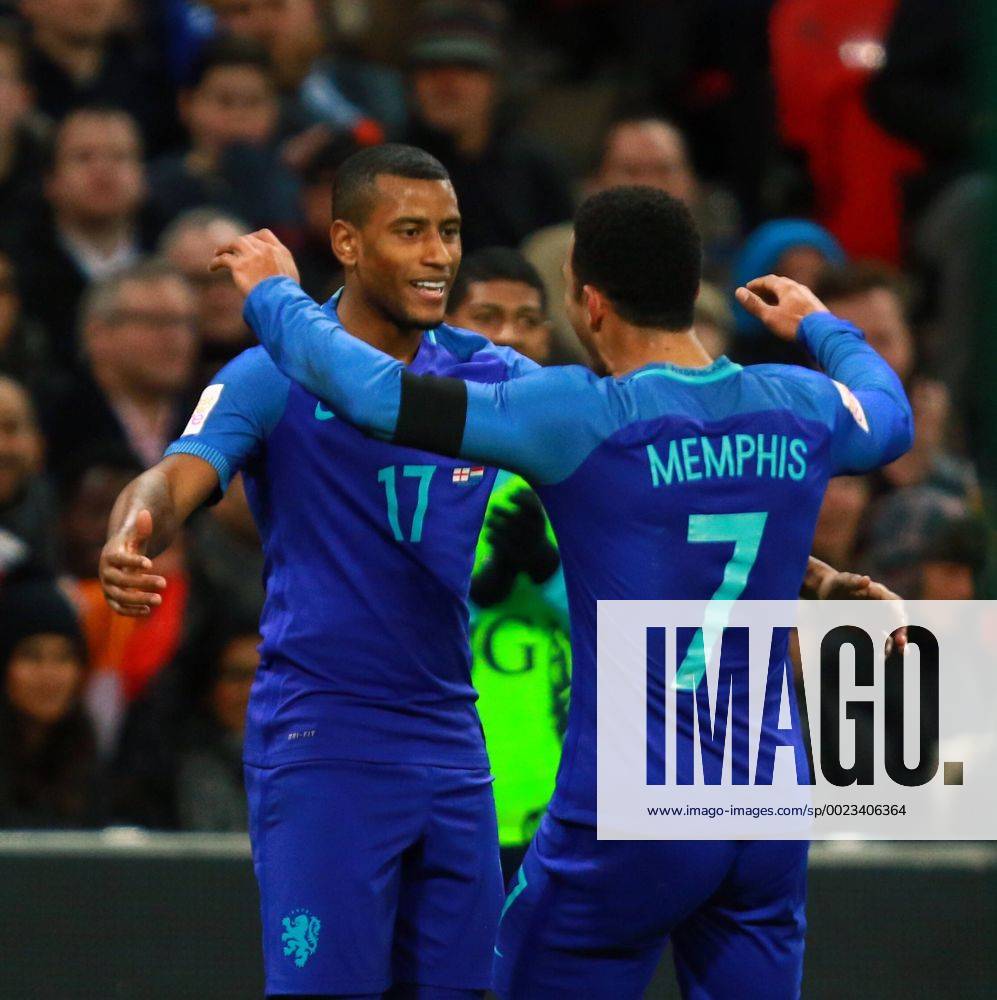 England v Netherlands . . Wembley, London, UK . . 29.03.2016 Luciano Narsingh (N) celebrates scoring the winning goal for Netherlands with Memphis Depay (N). 1-2
