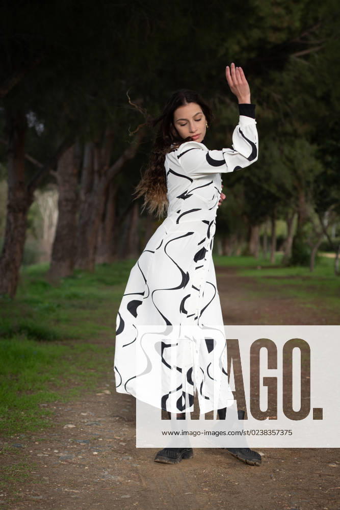 Young woman dancing outdoors. Dance performance in the street Young woman dancing outdoors. Dance performance in the park