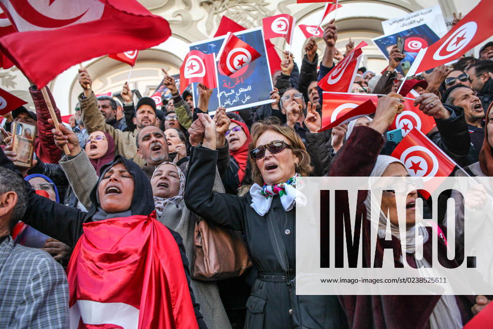 National Salvation Front Protests Over Arrests Of Opposition Figures In Tunis Demonstrators shout slogans while making the victory sign and raising flags of Tunisia, during a demonstration held by the National Salvation Front opposition alliance, in Tunis, Tunisia, on March 5, 2023, to call for the release of arrested and detained opposition figures deemed critical of President Kais Saied. Demonstrators labelled Kais Said s rule as a dictatorship and criticised the economic policy of the government. A few weeks ago Tunisian authorities started a wave of arrests targeting prominent Tunisian dissidents. Tunis TUNIS Tunisia