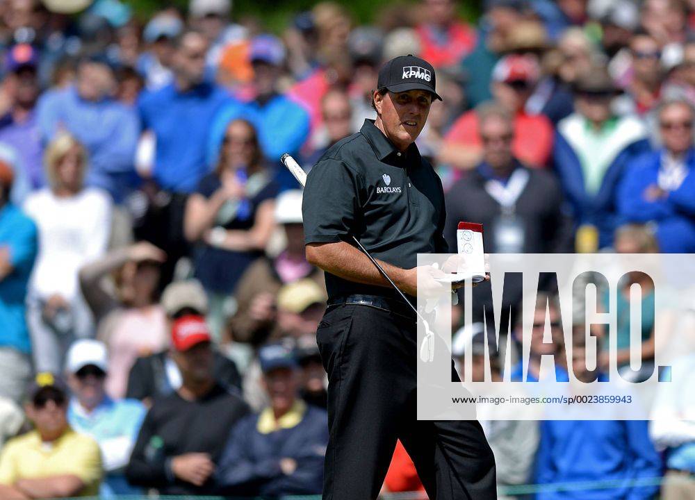 Charlotte, NC, USA - Phil Mickelson checks his yardage book as he walks onto the third green during second round action of the Wells Fargo Championship at Quail Hollow Club on May 6, 2016 in Charlotte, N.C. Mickelson finished the round at -5. Wells Fargo Championship - ZUMAm67_