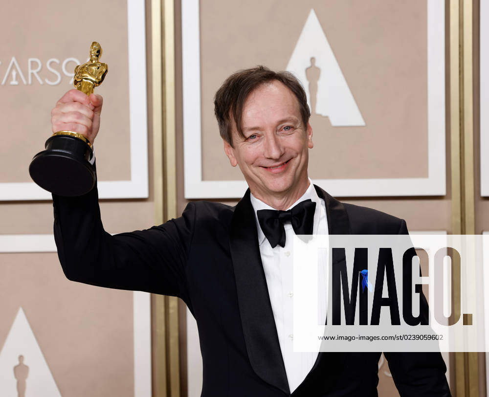 Volker Bertelmann, winner of the award for Best Original Score for All Quiet On The Western Front,??? appears backstage with his Oscar during the 95th annual Academy Awards at Loews Hollywood Hotel in the Hollywood section of Los Angeles on Sunday, March 12, 2023. LAP20230312218 JOHNxANGELILLO