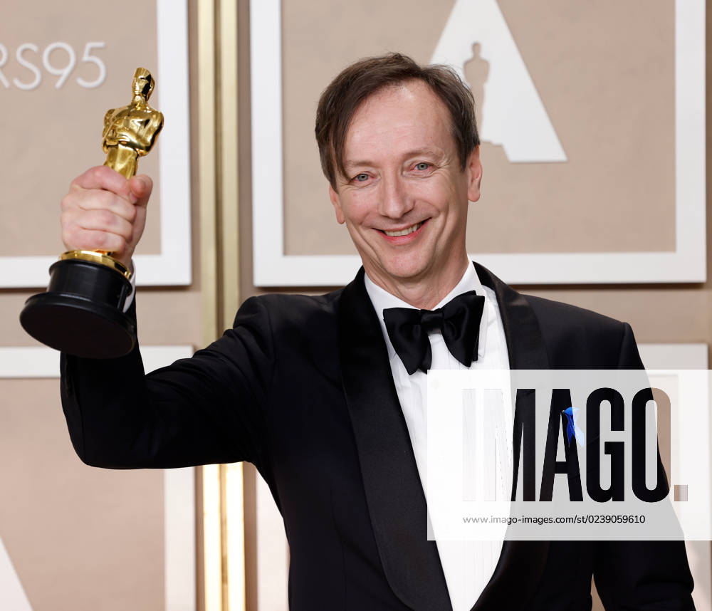 Volker Bertelmann, winner of the award for Best Original Score for All Quiet On The Western Front,??? appears backstage with his Oscar during the 95th annual Academy Awards at Loews Hollywood Hotel in the Hollywood section of Los Angeles on Sunday, March 12, 2023. LAP20230312219 JOHNxANGELILLO