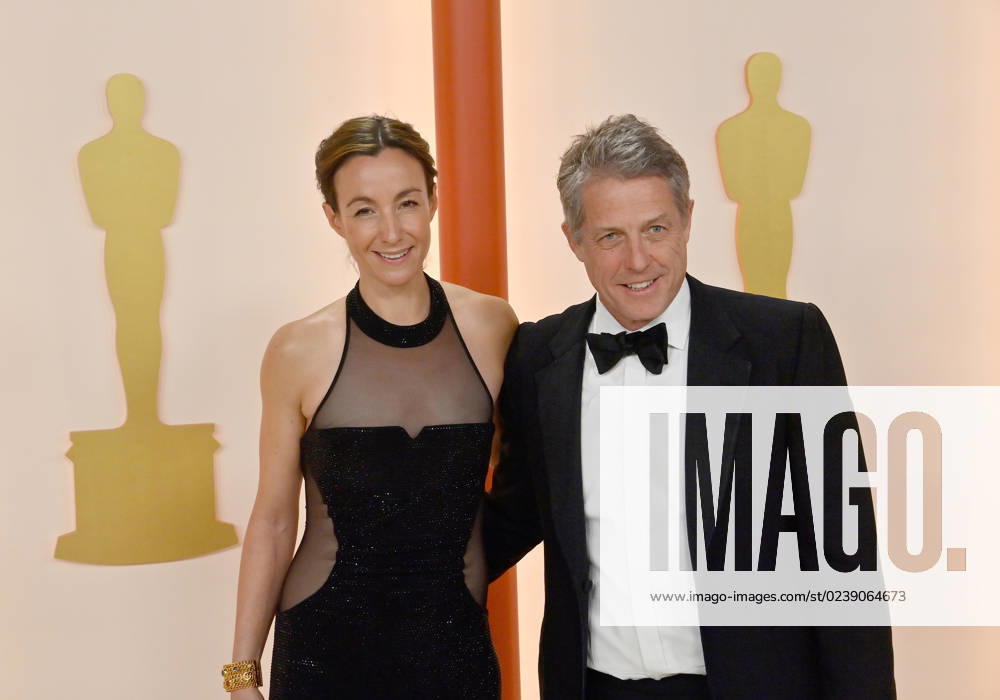 (L-R) Anna Eberstein and Hugh Grant attend the 95th annual Academy Awards at the Dolby Theatre in the Hollywood section of Los Angeles on Sunday, March 12, 2023. LAP2023031211282 JIMxRUYMEN