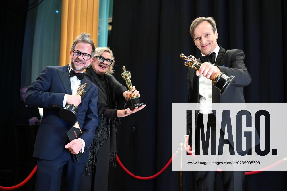 Ernestine Hipper and Christian M. Goldbeck pose backstage with the Oscar® for Production Design and Volker Bertelmann poses with the Oscar® for Original Score during the live ABC telecast of the 95th Oscars® at the Dolby® Theatre at Ovation Hollywood on Sunday