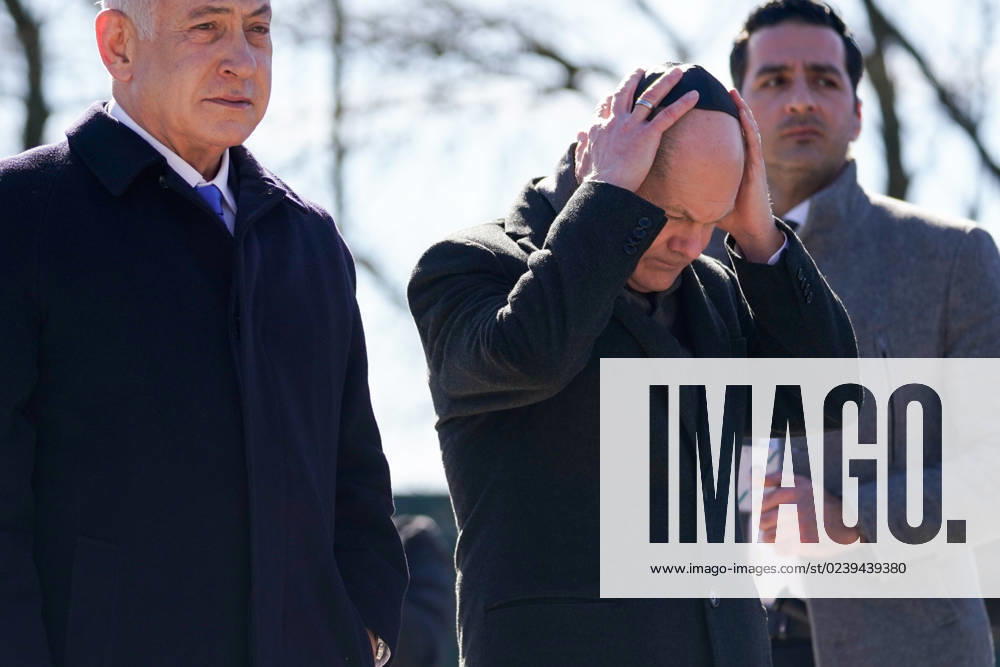 Berlin, Germany 16 March 2023 Visit at the memorial track 17 in Berlin Grunewald 16 03 2023 In the picture from left Benjamin Netanyahu, Prime Minister of Israel, Chancellor Olaf Scholz SPD , Chancellor Olaf Scholz SPD puts his kippa on memorial track 17 Berlin