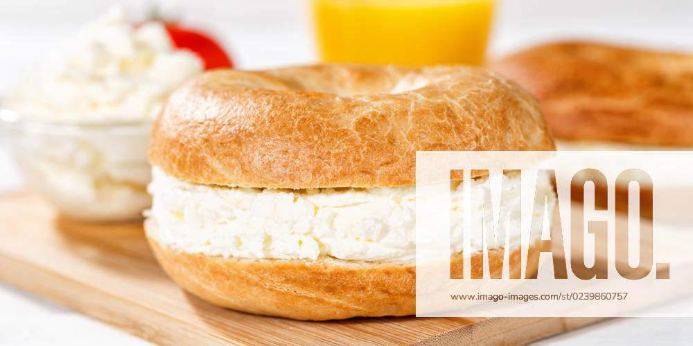 Bagel roll sandwich for breakfast topped with cream cheese close up panorama in Stuttgart, Germany Stuttgart, Germany 18 March 2023 Bagel roll sandwich for breakfast topped with cream cheese close up panorama in Stuttgart, Germany