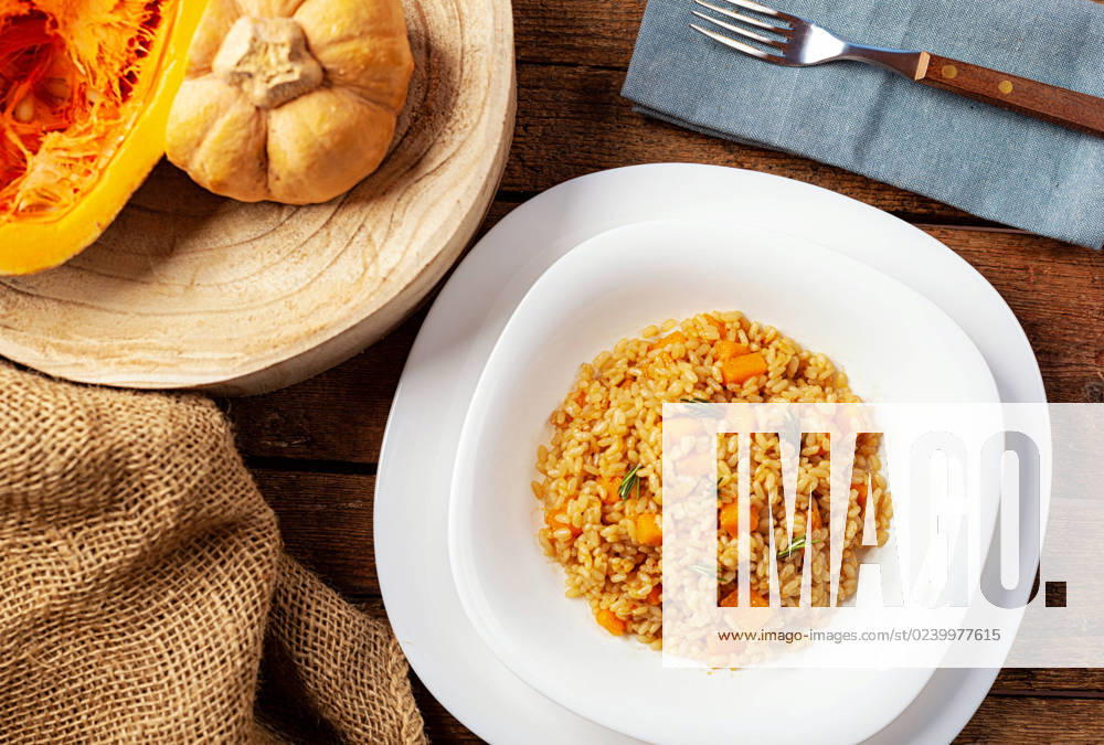 Pumpkin risotto, Recipe with Rice and Pumpkin at rustic Table with Ingredients Recipe for Autumn and Halloween 1085317607