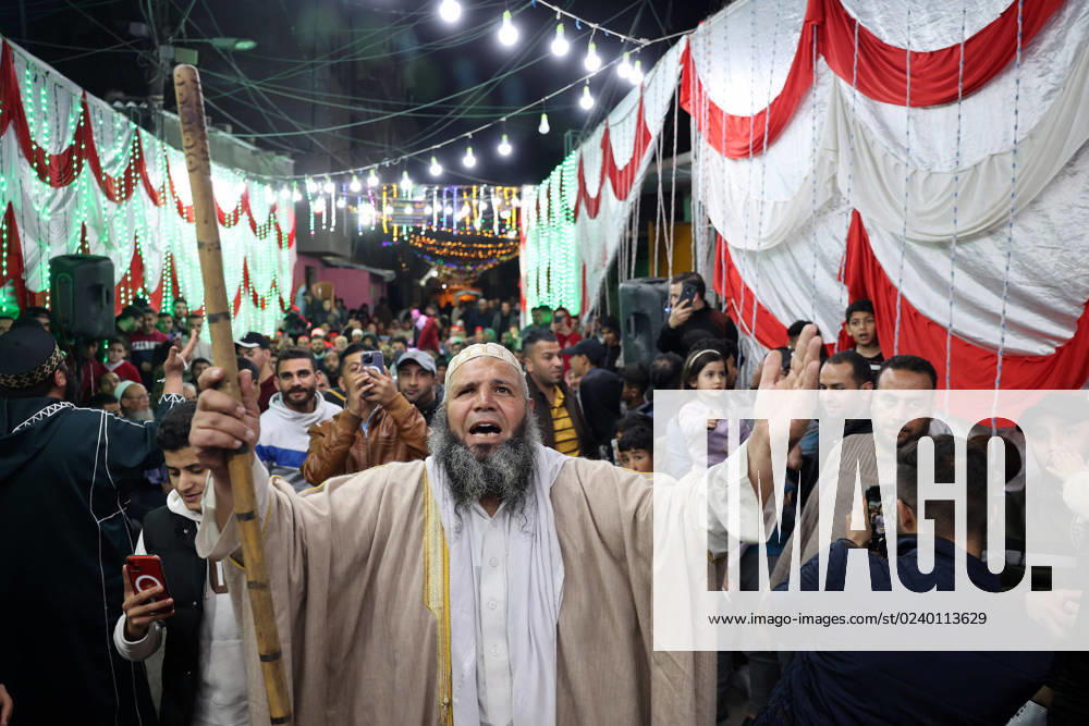 KW12 Palestinians take part in a festive event to celebrate Ramadan, the holiest Muslim month, two days before it starts, in Khan Yunis town in the southern Gaza Strip on Wednesday March 22, 2023. Muslims throughout the world are celebrating Ramadan, the holiest month in Islamic calendar, refraining from eating, drinking, smoking and sexual relations from dawn to dusk, It is believed that during this month the Prophet Mohammed received the revelations of the Quran. GAZ2023032206 IsmaelxMohamad