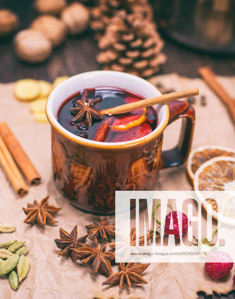 Drink mulled wine in brown ceramic mug on kraft paper, vintage toning , 30782994.jpg, alcohol, anise, aromatic, background, beverage, brown, cardamom, celebration, christmas, cinnamon, citrus, closeup, cup, decoration, drink, dry, festive, food, fruit, grog, holiday, homemade, hot, ingredient, mulled, natural, orange, paper, punch, raspberry, red, rustic, slice, spice, spoon, star, sugar, sweet, table, traditional, vintage, wine, winter, wood, wooden, xmas