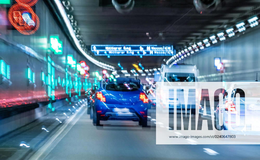 Traffic on the Mittlerer Ring, cars driving through a tunnel, Munich, March 2023 Germany, Munich, March 2023, traffic on the Mittlerer Ring, cars driving through a tunnel, multi-lane road, light trails through long exposure, city traffic, cars, symbol photo tunnel view, driver sees everything twice, drunk driving, dru