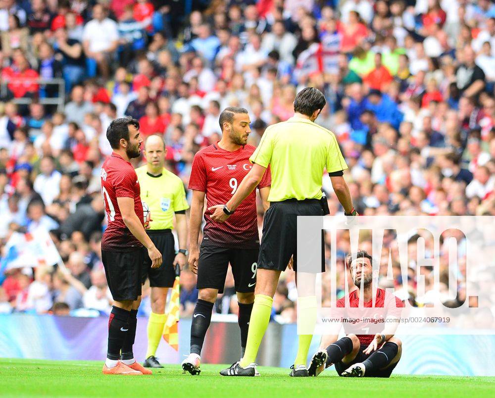 Friendly National football Match between England and Turkey at Etihad Stadium in Manchester , England on May 22, 2016. Pictured: Referee Deniz Aytekin and Volkan Sen (L), Cenk Tosun (C) , Gokhan Gonul of Turkey.