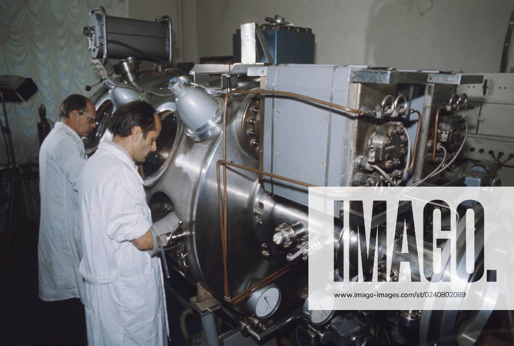 Moscow, USSR. September, 1976. Technicians of the receiving laboratory at the USSR Academy of Sciences work with a vacuum chamber containing the Lunar soil retreived by the Luna-24 Soviet Automatic Interplanetary Station. The exact date of the photograph is unknown. Valentin Kuzmin TASS 17967501