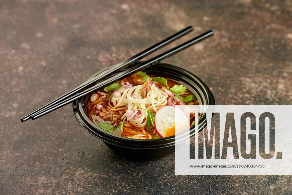 Birria ramen, consomme soup with beef and noodle. Mix of Mexican and Asian cuisine Birria ramen, consomme soup with beef and noodle. Mix of Mexican and Asian cuisine.