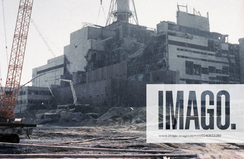 August, 1986. Kiev Region, Ukrainian SSR, USSR. The view shows the Shelter Structure covering the reactor no. 4 of the Lenin Chernobyl Nuclear Power Plant after the accident under construction. On April 26, 1986, an explosion occurred at the reactor no. 4 of the NPP during equipment tests after the shutdown of the reactor for the next scheduled preventive maintenance. The exact date of the photograph is unknown. Valery Zufarov, Vladimir Repik T 190999