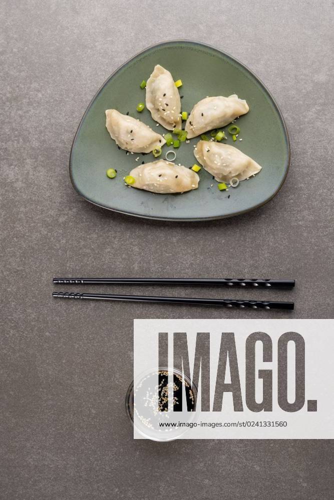 IMAGO Creative, Food, Dumplings Overhead view of dumplings, soy sauce and chopsticks on grey background Overhead view of dumplings, soy sauce and chopsticks on grey background. Asian tasty home cooked food and healthy eating., model released, , property released, Cape Town, South Africa, 14.07.2022, 3766877.jpg, overhead view,dumpling,soy sauce,chopstick,grey background,asian,tasty,home,cooked,food,healthy eating,delicious,meal,gourmet,fresh,cuisine,dinner,snack,lunch,cooking,sweet,diet,nutrition,healthy,dessert,dish,organic,ingredient,eat,fruit,meat,overhead,view,soy,sauce,grey,background,eating