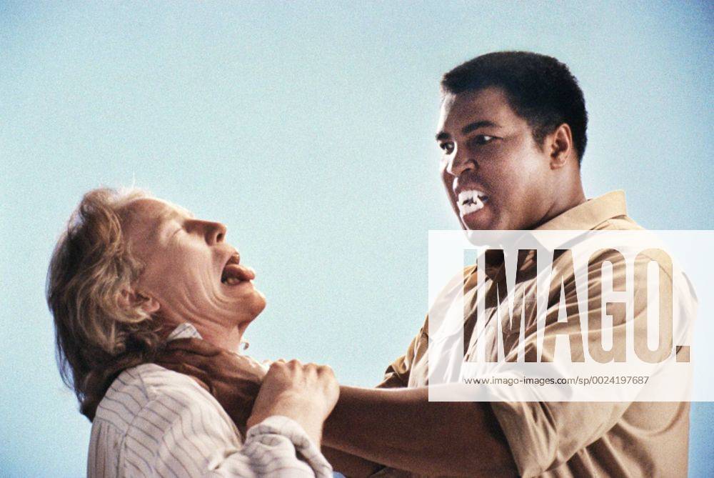 Muhammad Ali London, UK. EXCLUSIVE: Muhammad Ali (with the director of the commercial playing around) in London in around 1988. He was in London to shoot a commercial for a powdered milk product but happily posed for a set of informal photographs taken by Christina Jansen. ReCaptioned 4th June 2016 following news of Muhammad Ali s death at the age of 74. SPECIAL PRICING. Images can be used at twice times stock rate library fees including on-line. CREDIT MANDATORY. CHRISTINA JANSEN LANDMARK MEDIA. LMK379-60635-040616