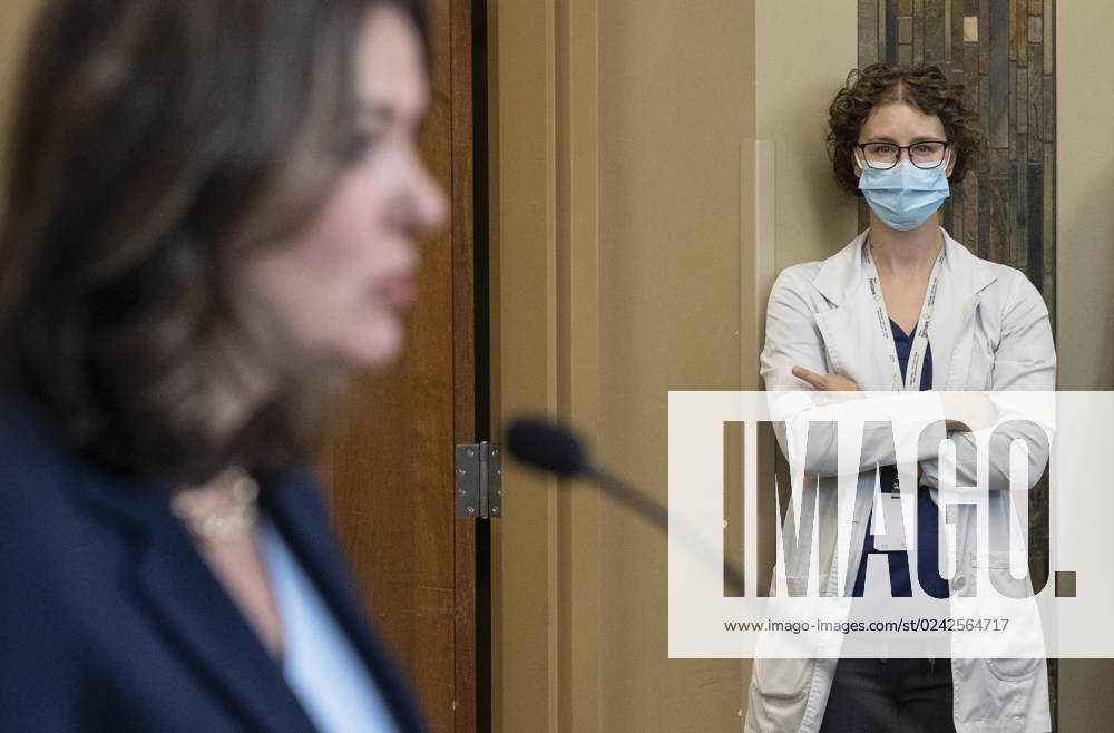 A healthcare worker gives the middle finger as Alberta Premier Danielle Smith announces a public health guarantee in Sherwood Park, Alta., Tuesday, April 11, 2023. SHERWOOD PARK CANADA - ZUMAc35_ 20230411_zaf_c35_018