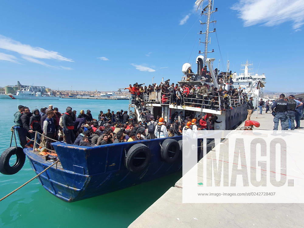 The fishing boat carrying about 600 migrants rescued in recent days 100 miles off the coast of Sicily towed by a tugboat arrived in the port of Catania, Italy, 12 April 2023. The vessel was escorted by the Nave Peluso of the Coast Guard. The migrants on board greeted their arrival with applause and whistles and shouts of Bella Italia ..ANSA Catania - ZUMAa110 20230412_zaf_a110_022
