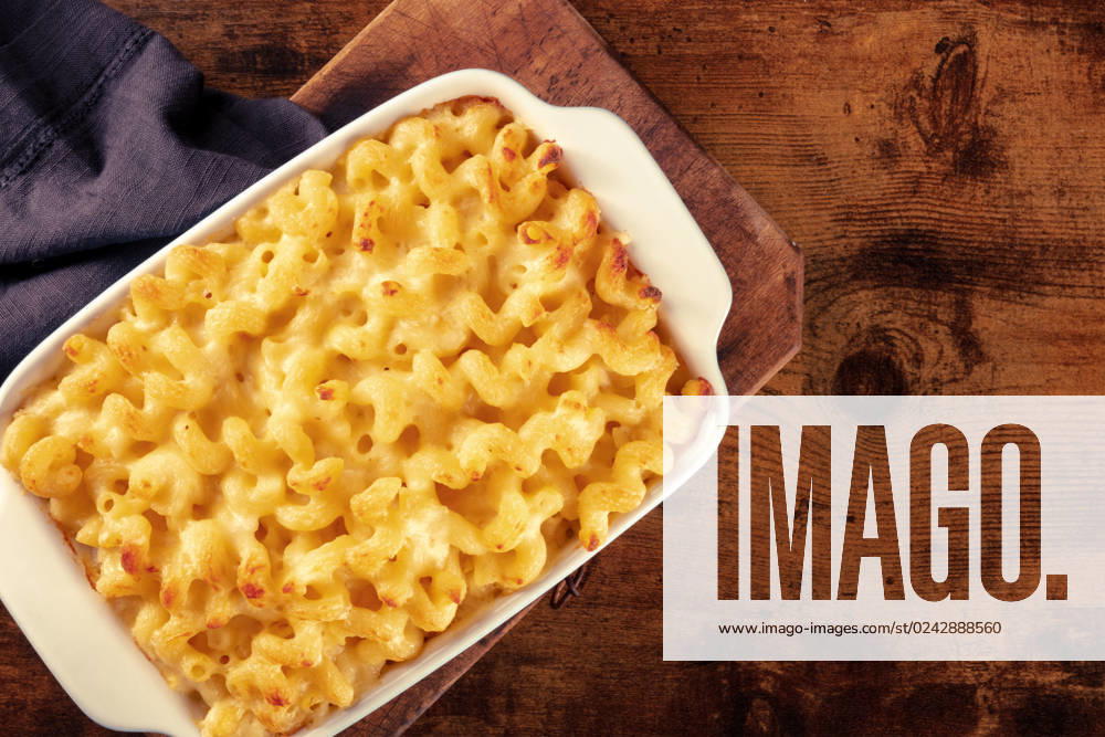 Macaroni and cheese pasta in a casserole, shot from the top Macaroni and cheese pasta in a casserole, shot from the top on a rustic background with copy space
