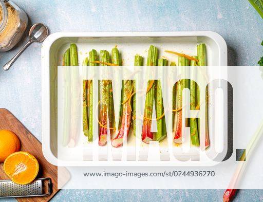 A closeup shot of rhubarb stalks in a rectangle plate. Top view. *** einer closeupe erschossen des Rhabarber pirscht ÊIn einer Rechteck Teller Spitze Ansicht 2469594