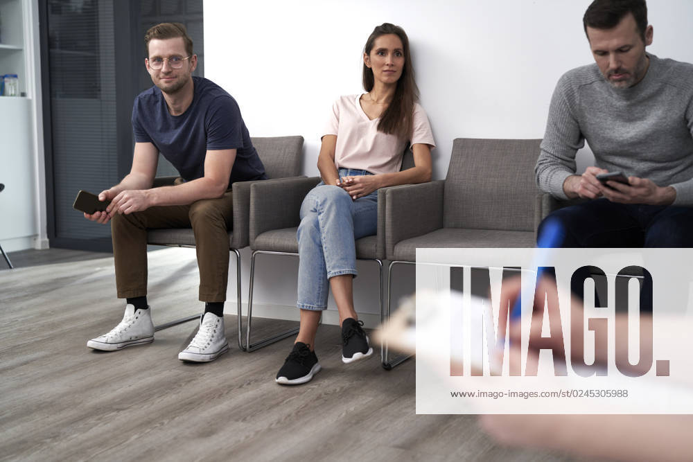Men and women sitting in waiting room at clinic model released, Symbolfoto property released, ABIF01846