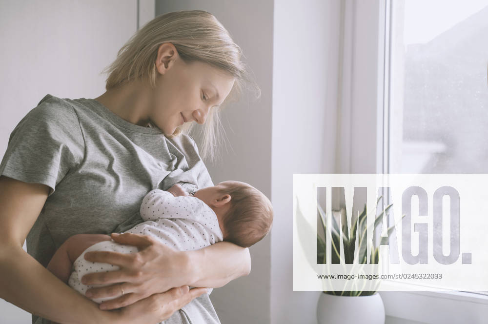 Mother breastfeeding baby boy at home model released, Symbolfoto property released, NDEF00467