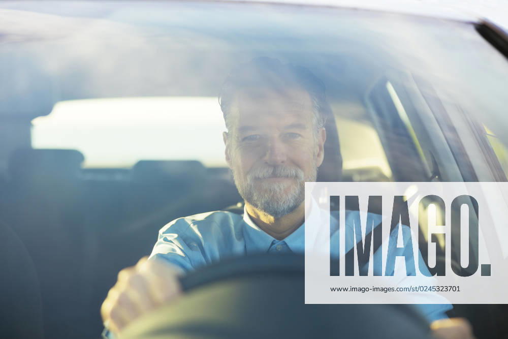 Man driving car seen through windshield model released, Symbolfoto, EBSF03194