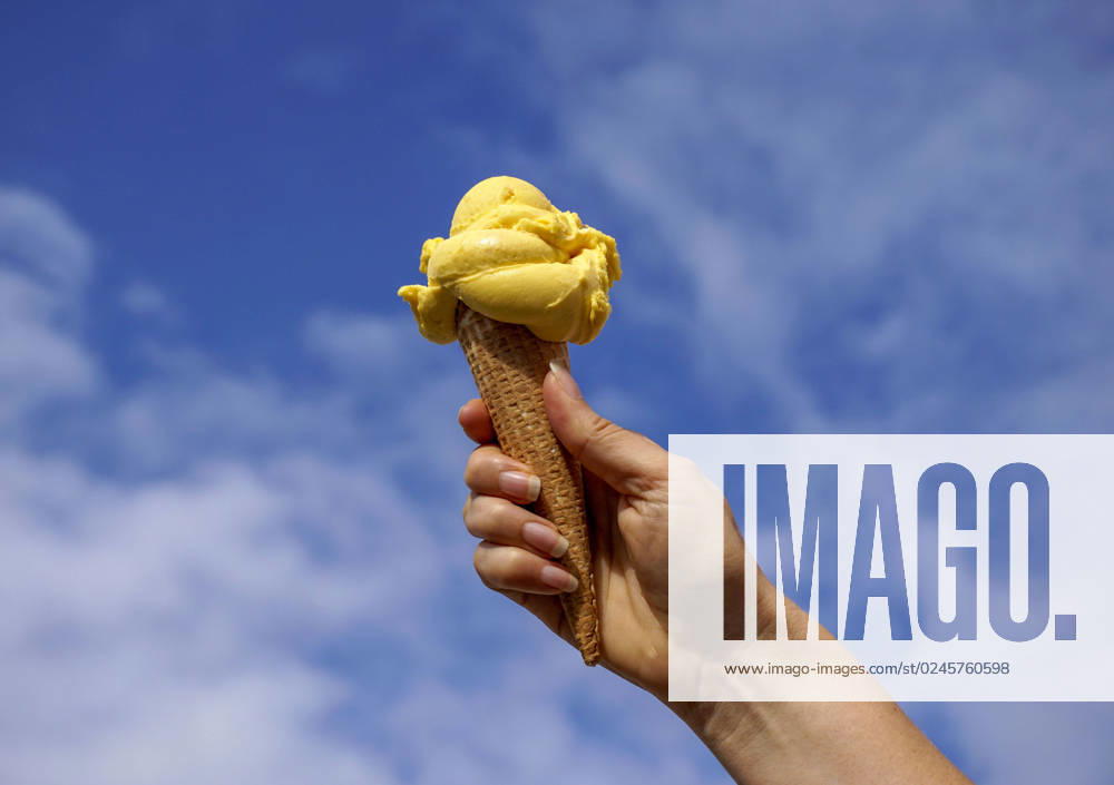Ice cream cone with mango ice cream from an Allgäu ice cream parlor 27 04 2023, Ice cream cone 27 04 2023, Ice cream cone