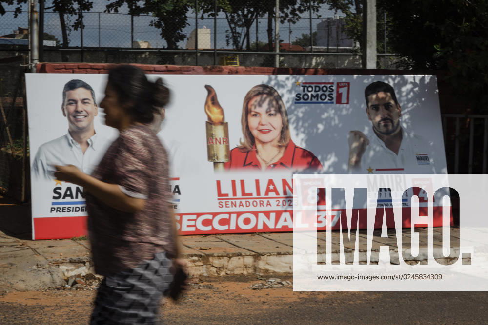 A woman walks past a campaign election banner for Paraguay s presidential candidate for the Colorado Party, Santiago Pena (L), the Senate candidate Lilian Samaniego and Deputy candidate Mauricio Espinola, in Asuncion, Paraguay. Paraguay will hold general and presidential elections on April 30, 2023. Asuncion Paraguay - ZUMAc217 20230427_zip_c217_001
