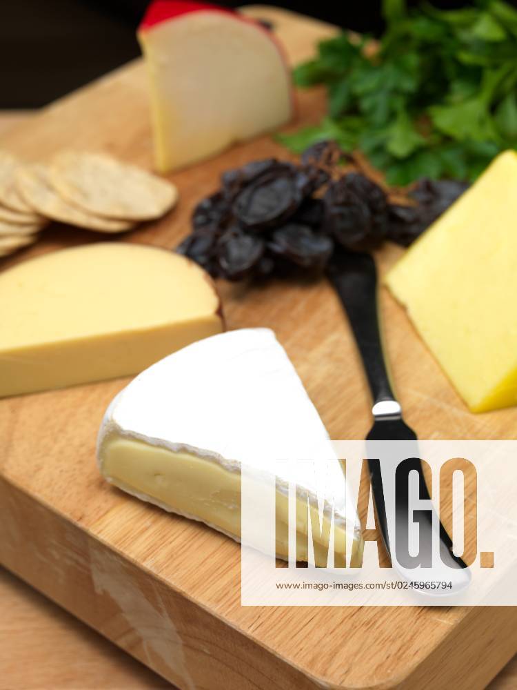 A selection of cheeses on a cutting board