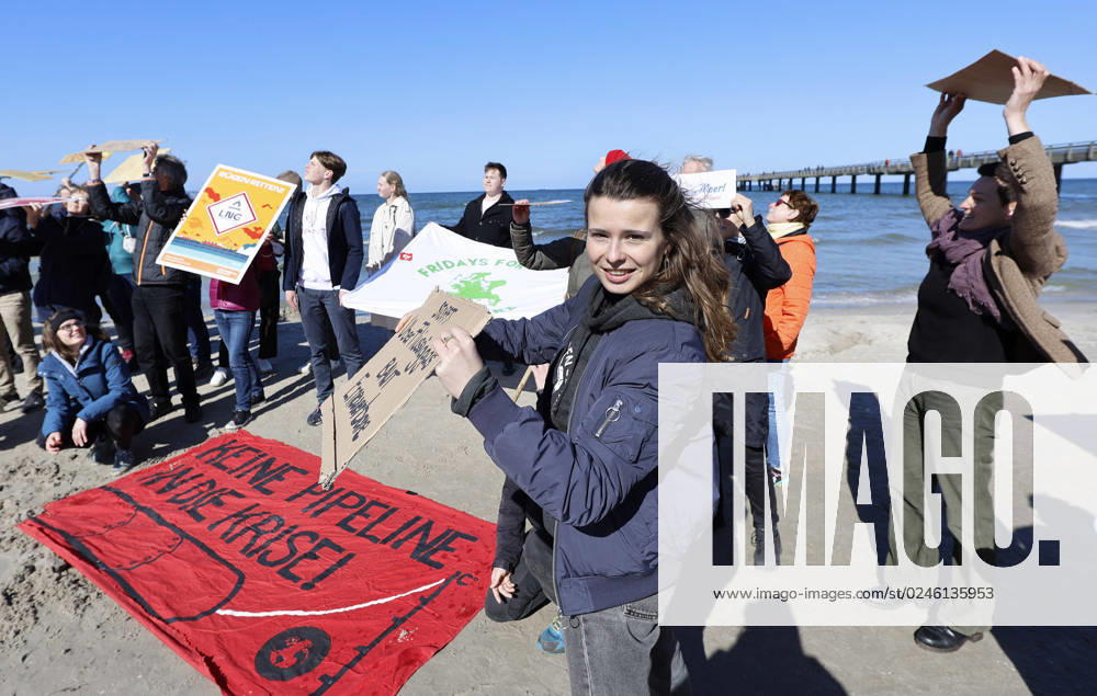 Climate activists demonstrate on Ruegen Climate activist Luisa Neubauer M demonstrates at the seaside bridge in Binz County Western Pomerania Ruegen against a possible LNG terminal on the island of Ruegen Almost 100 activists and sympathizers participate in event on the Baltic Sea beach Neubauer said she had come at the invitation of Ruege