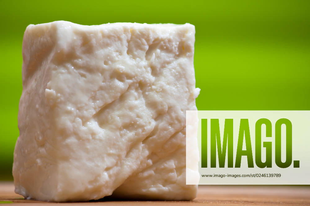 Big slices of Curd cheese on cutting board. * Selective focus.