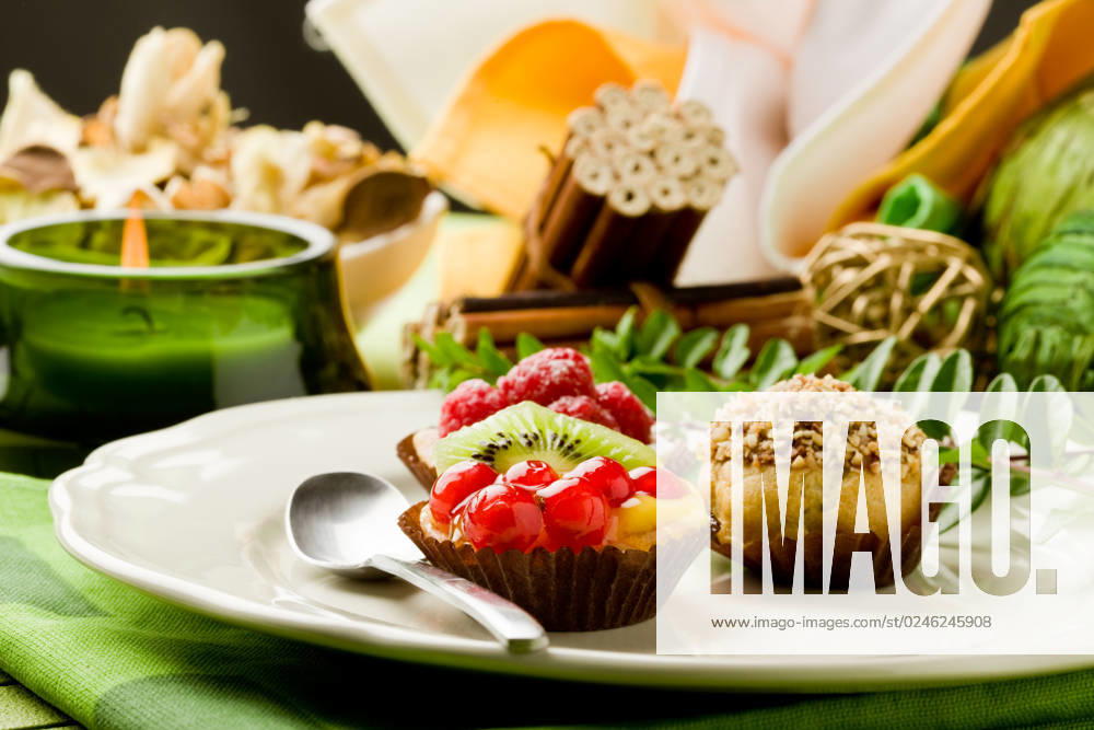 Photo of delicious dessert plate with italian fruits pastries