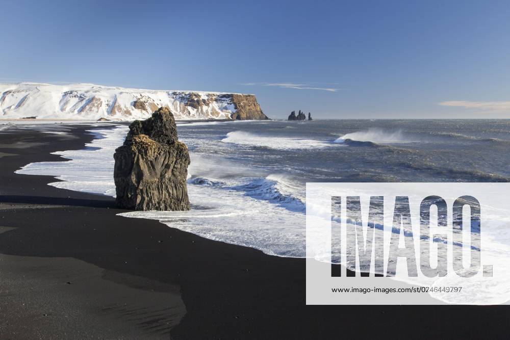 Arnardrangur, Eagle Rock, Basalt sea stack on Black people sandy beach Reynisfjara at Vík í Mýrdal, Iceland, Europe