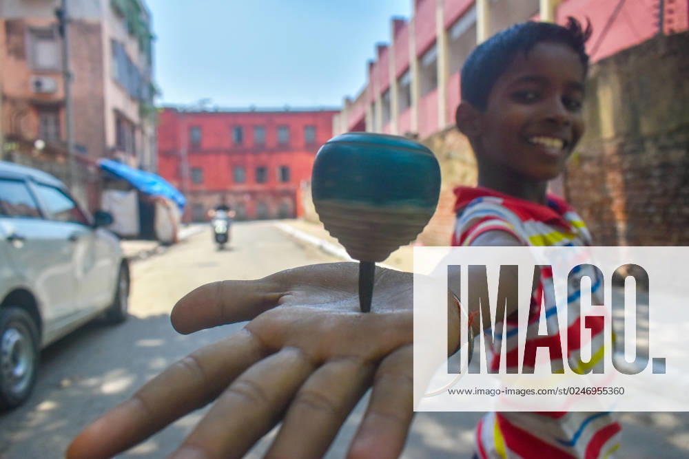 Daily Life In Kolkata A boy is playing with a spinning top in Kolkata, India on May 7, 2023. Kolkata India