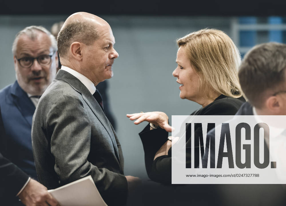 Chancellor Olaf Scholz SPD talks with Nancy Faeser SPD , Federal Minister of the Interior and Home Affairs, on the sidelines of the Chancellors consultations with the heads of government of the states 10 05 2023, Berlin Berlin Germany