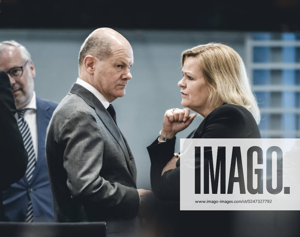 Chancellor Olaf Scholz SPD talks with Nancy Faeser SPD , Federal Minister of the Interior and Home Affairs, on the sidelines of the Chancellors consultations with the heads of government of the states 10 05 2023, Berlin Berlin Germany